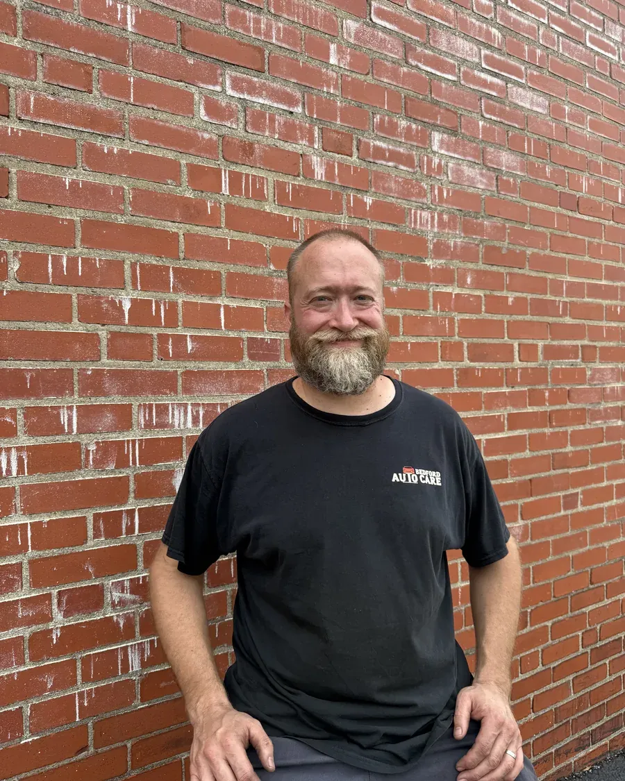 Frank Jr. outside Bedford Auto Care